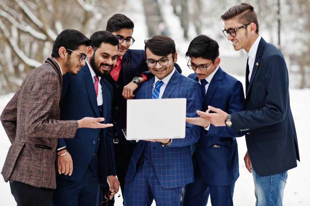 group-six-indian-businessman-suits-posed-outdoor-winter-day-europe-looking-laptop